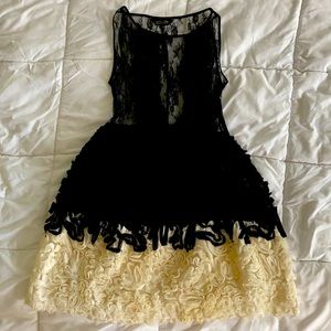 Akira lace party dress with white rosettes.